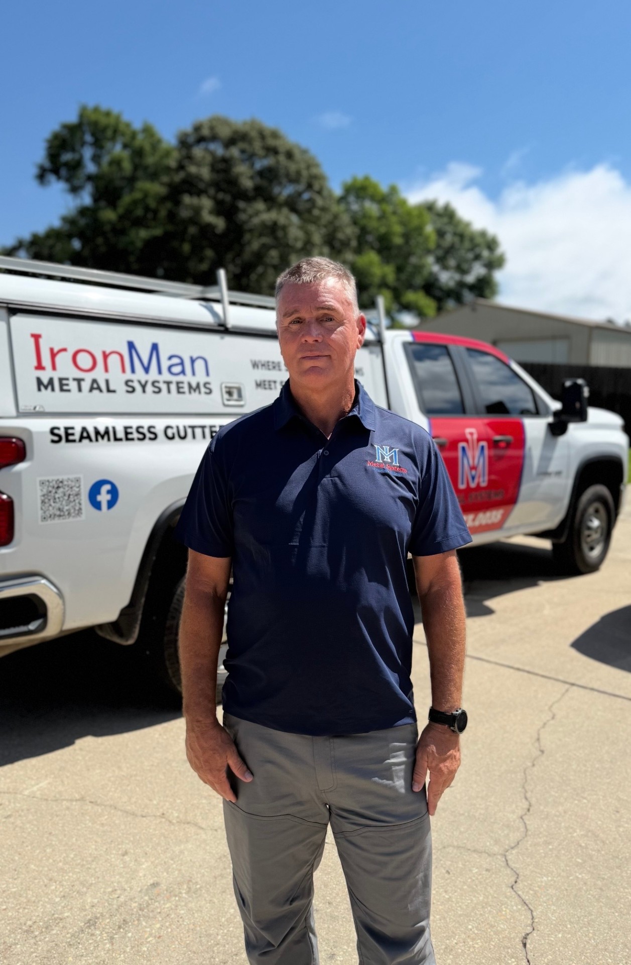 Gary, owner of IronMan Metal Systems, in front of company truck